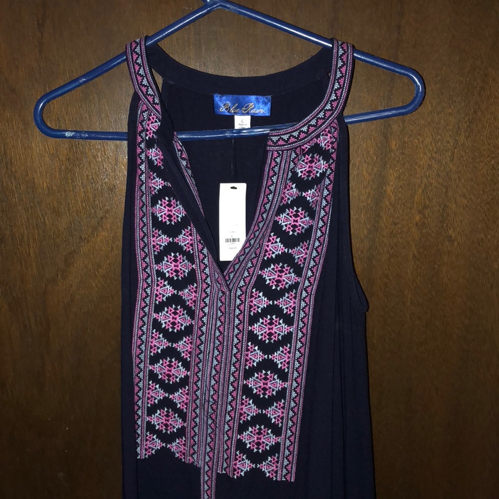 Navy dress with embroidery in the front.